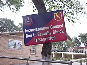 Apologetic sign at the border with Pakistan, near Amritsar, Punjab.